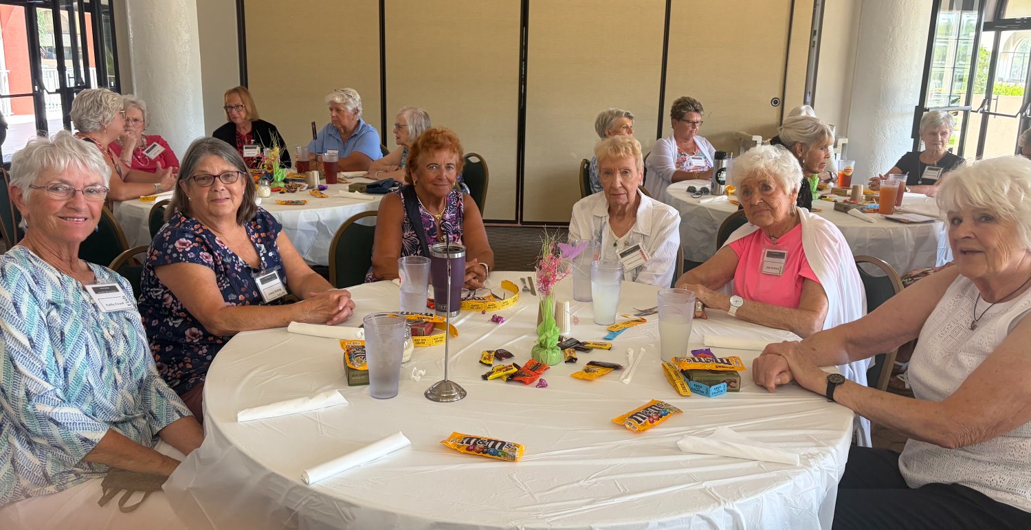 Arts & Crafts members chatting at a table during the monthly lunch