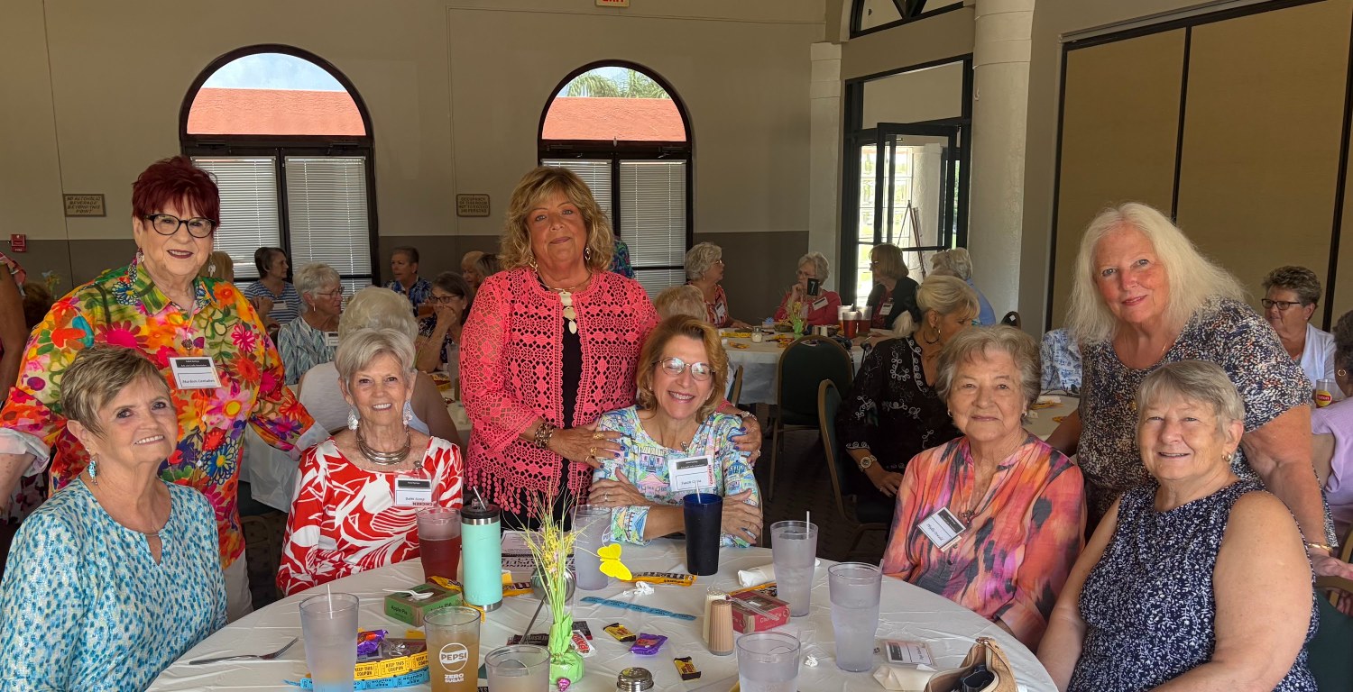 Arts & Crafts members at a table with chocolate treats at the monthly lunch