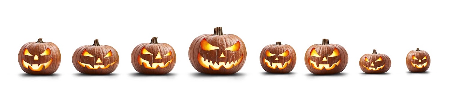 Row of carved jack-o’-lanterns glowing in a line