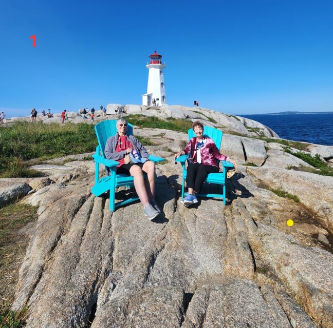 Lighthouse on massive granite rocks at Peggy's Cove, Nova Scotia
