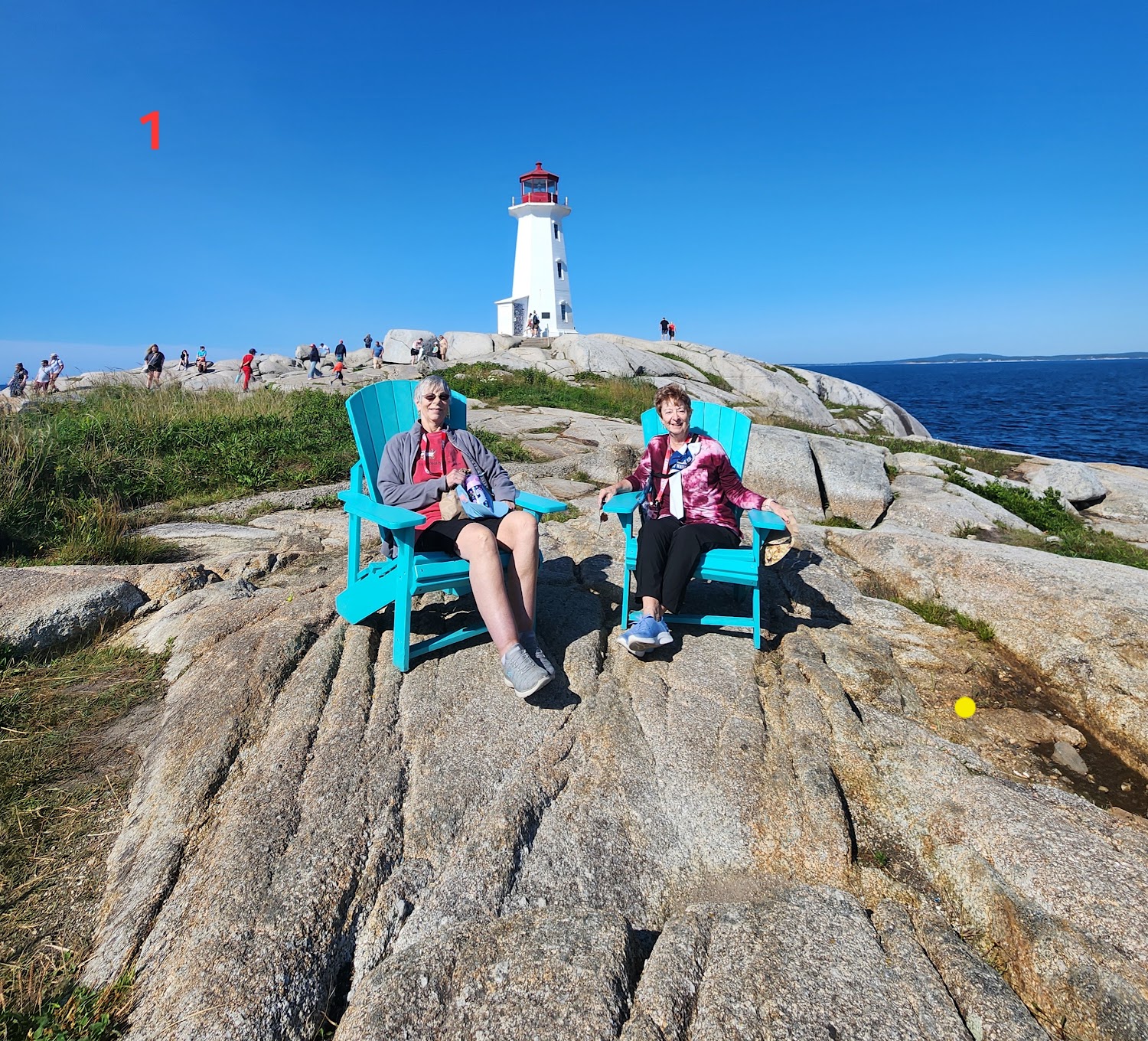 Lighthouse on massive granite rocks at Peggy's Cove, Nova Scotia
