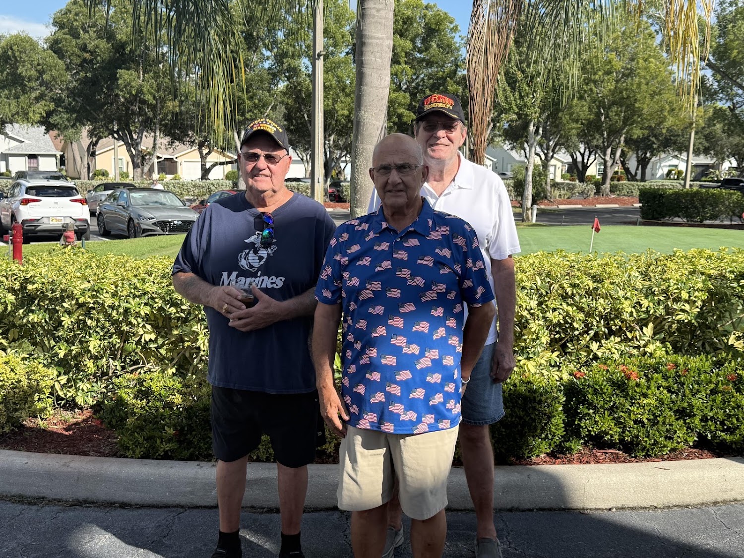Three Sabal Springs Marine Corps veterans outside the Clubhouse.