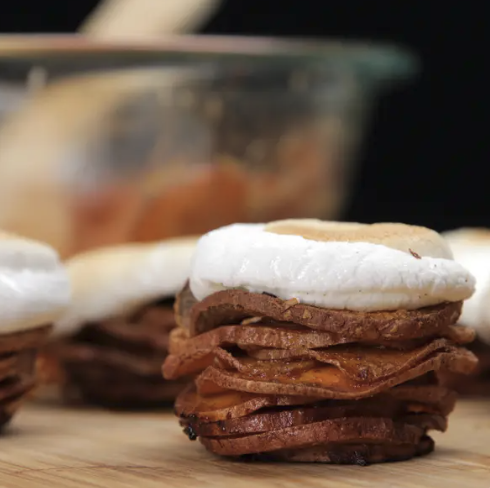 Sweet potato stack topped with a toasted marshmallow.